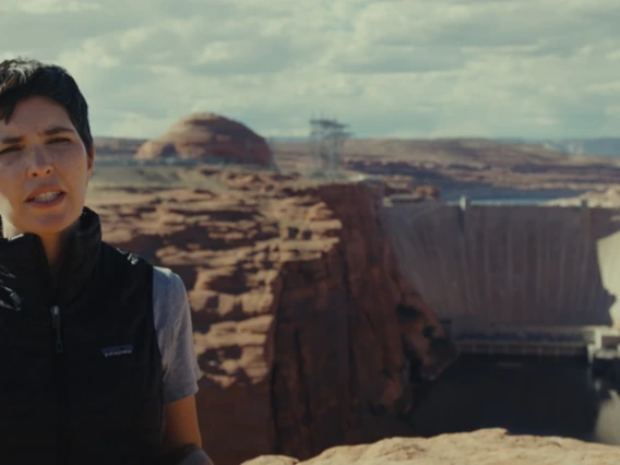 Kerri Hickenbottom stands in front of the Hoover Dam in the documentary "Flowing Forward: “Shared Water"