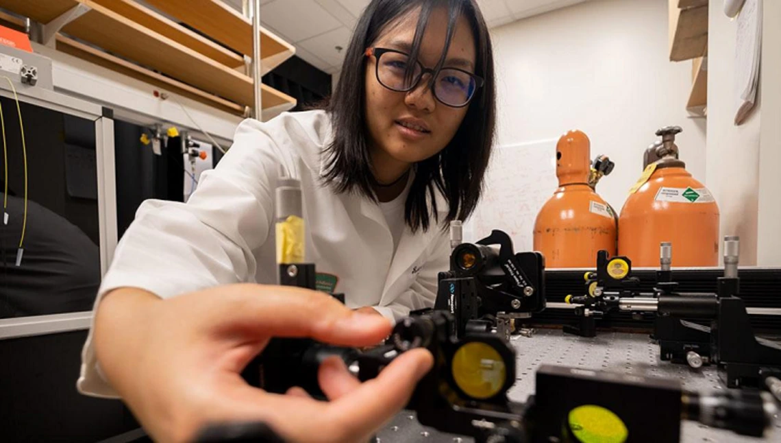 woman wearing glasses in laboratory