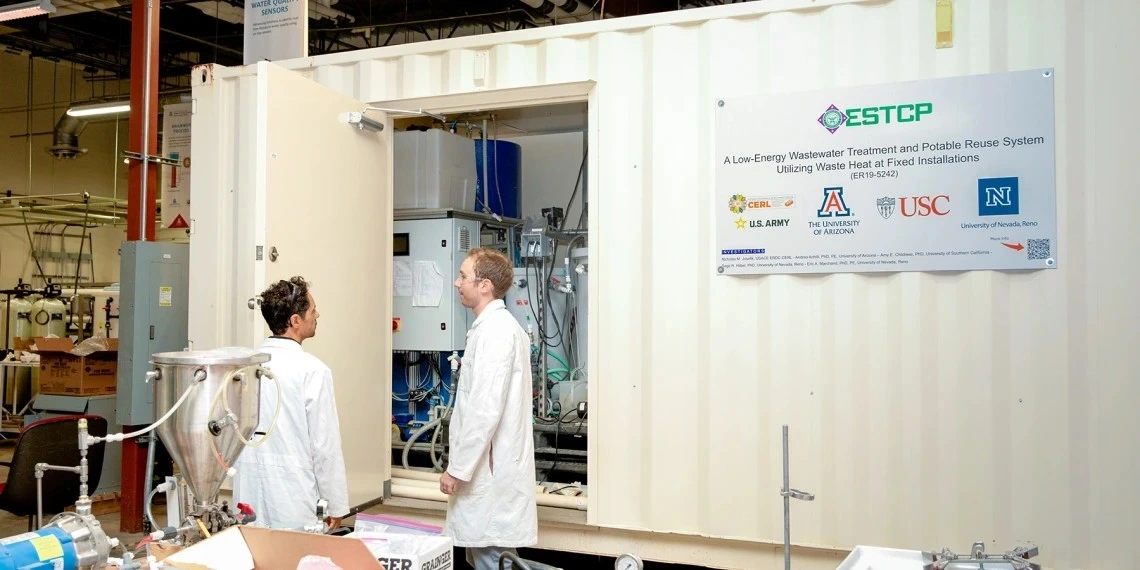 Associate professor of chemical and environmental engineering at the Unversity of Arizona College of Engineering Andrea Achilli (left) and Luke Presson (right) evaluate the ESTCP Demonstration Project semi-portable, containerized advanced water purification unit.