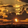 Clouds in an orange sunset over the desert